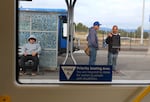 Riders wait at the Gateway Transit Center in Portland, Ore., Aug. 26, 2026.