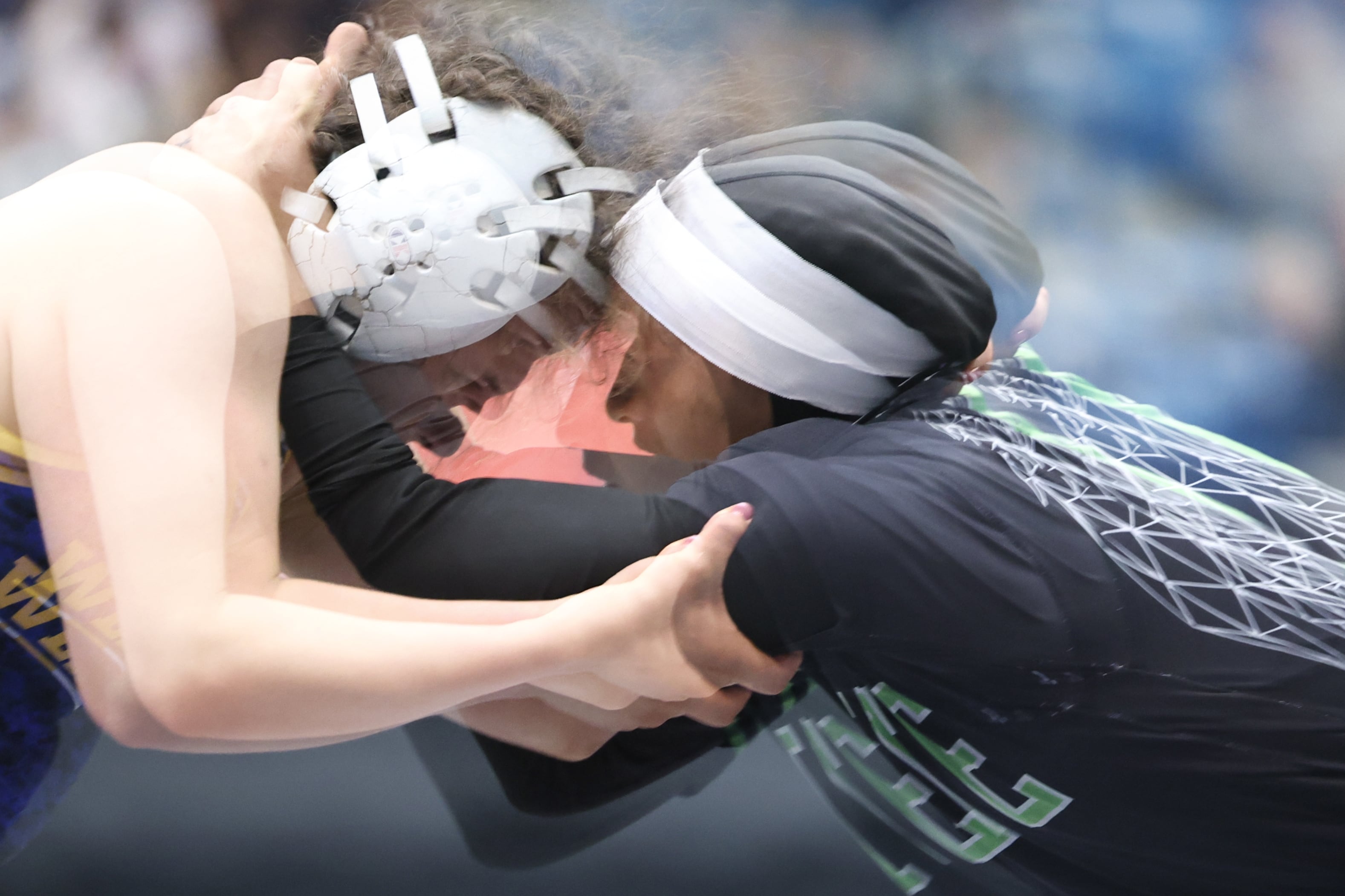 Zaynah McBryde (right) battles with Samantha Barragan of Texas Wesleyan University at the 2025 NAIA Women's Wrestling National Championship.
