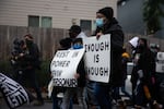 Kevin Peterson Sr., gray hoodie, leads a march Dec. 6, 2020 to protest his son's death by police weeks prior. Peterson Jr. died after three officers shot him during a botched drug bust outside Vancouver.