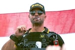 Proud Boys leader Henry "Enrique" Tarrio wears a hat that says The War Boys during a rally in Portland, Ore. on Sept. 26, 2020. Tarrio pleaded not guilty on Tuesday, April 5, 2022, to charges that he remotely led a plot to stop Congress’ certification of Joe Biden’s 2020 victory.