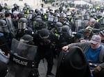 In this Jan. 6, 2021, file photo, U.S. Capitol Police push back rioters trying to enter the U.S. Capitol in Washington.