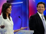 Republican presidential candidate former U.N. Ambassador Nikki Haley speaks as Florida Gov. Ron DeSantis listens during a Republican presidential primary debate hosted by NBC News on Wednesday in Miami.