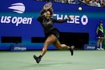 Serena Williams, of the United States, returns a shot to Ajla Tomljanovic, of Australia, during the third round of the U.S. Open tennis championships, Friday, Sept. 2, 2022, in New York. Williams' third-round defeat at by Ajla Tomljanovic had the largest audience of any tennis match in ESPN's 43-year history.