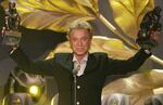 German illusionist Siegfried Fischbacher of the duo " Siegfried & Roy" holds their trophies after receiving the World Entertainment Award at the World Award 2003 ceremony in Hamburg, northern Germany, on Oct.22, 2003. German news agency dpa is reporting that Fischbacher, the surviving member of duo Siegfried & Roy has died in Las Vegas at age 81. The news agency said Thursday that Fischbacher’s sister, a nun who lives in Munich, confirmed his death of cancer.