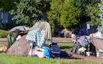 FILE - Homeless encampment in North Portland near North Rosa Parks Way exit on I-5, Oct. 11, 2021.