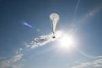 A balloon taller than a football field is placed over the Moose Fire in Idaho earlier this month to provide mapping imagery for wildfire incident commanders as part of a trial.