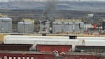 On March 10, 2023, smoke emanates from a railroad ties treatment plant in The Dalles, Ore., after a fire and explosion from the night before.