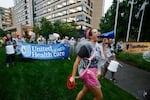 Health care advocates are shown protesting care denials at UnitedHealthcare's offices on July 15, 2024 in Minnetonka, Minnesota.