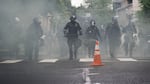 Portland police used tear gas and rubber bullets to disperse protesters from near the Justice Center an hour before the 8 p.m. curfew went into effect on May 30, 2020. The protests were against racist violence and police brutality in the wake of the killing of George Floyd by a white Minneapolis police officer.