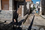 Fourni, GREECE: 10/01/25 An elderly woman on the streets of Fourni. In Greece, the birthrate is so low that the population is shrinking and aging. Ayman Oghanna for NPR