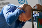 FILE: A festival-goer cools down at a free water and misting station at the Waterfront Blues Festival in Portland, Ore., July 6, 2024.  Hot weather led to hospitalizations in Oregon last year, a report on climate change and health has found.