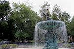 A bronze fountain stands in the center of St. James Court, a tree-covered boulevard in Old Louisville.