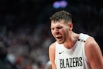 Portland Trail Blazers center Donovan Clingan screams in celebration.