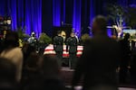 Two honor guard members stand in front of Vancouver police officer Donald Sahota's casket at a memorial on Feb. 8, 2022. Sahota died Jan. 29 after being mistakenly shot by a Clark County Sheriff's Deputy.