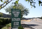 A sign indicates the storefronts for lease in the Gateway Shopping Center in East Portland, Ore., July 31, 2025. Following the announcement of Fred Meyer’s Gateway location closing, residents are unsure about coming changes to the neighborhood’s economy.