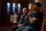 Rev. W. J. Mark Knutson, left, listens as Juan Francisco Aguirre-Velasquez gives an interview at the Augustana Lutheran Church, Thursday, Jan. 9, 2025, in Portland, Oregon. Aguirre-Velasquez, originally from El Salvador, sought sanctuary in the church to avoid deportation in 2014.