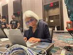 Arati Prabhakar, head of the White House's Office of Science and Technology Policy, tries out the AI challenge at Def Con. The White House urged tech companies to have their models publicly tested.