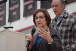 U.S. Rep. Suzanne Bonamici, flanked by Sen. Jeff Merkley, addresses a town hall in Rockaway Beach on Feb. 22, 2025. The large crowd said they were worried about the Trump administration's actions so far.