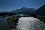 FILE - Water spills over the Bonneville Dam on the Columbia River, which runs along the Washington and Oregon state line, June 21, 2022.