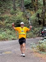 Clackamas Community College President Tim Cook finishes the last stretch of his "Running for Oregon Community College Students" campaign in Hood River, Ore., on Aug. 6, 2025.