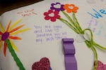 People leave messages of love and support for the Graham family at a fundraiser in Bend, Oct. 18, 2026.