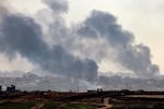 A view from the southern city of Sterod shows smoke rising above destroyed buildings in the northern Gaza Strip during an Israeli army bombardment on January 5, 2025. 