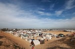 Children play at a makeshift tent camp for displaced Palestinians in Rafah near the border of Egypt in southern Gaza on Jan. 21.