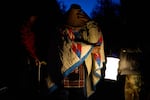 Bill Jones, a First Nations Pacheedaht elder, prepares to join a blockade on a road used for logging before dawn near Port Renfrew, British Columbia, Thursday, May 28, 2026.
