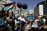 Craig and Cindy Corrie (center) take part in a protest against the Israeli occupation on March 20, 2008, in the West Bank city of Nablus.