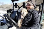 Rancher Ian Wilson and his dog Buddy regularly walk the newly restored floodplain looking for wildlife, 