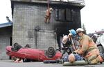 First responders rescue dummies from crumpled cars during the Cascadia Rising earthquake simulation in 2016.