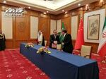 Secretary of Iran's Supreme National Security Council Ali Shamkhani (right) shakes hands with senior Chinese diplomat Wang Yi, as Saudi national security adviser Musaad bin Mohammed al-Aiban looks on during an agreement signing ceremony between Iran and Saudi Arabia to reestablish diplomatic relations and reopen embassies in Beijing, Friday.