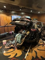 A vehicle, loaded with propane tanks, sits inside the Multnomah Athletic Club. Police officials say the car held 20 propane tanks and approximately 10 improvised explosive devices.