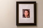 Peer case manager Lisa Greenfield keeps a framed mugshot of herself in her office at the Blackburn Center in east Portland, May 4, 2023. “That’s me in active addiction,” she said. “I have that framed just to identify with my people to show them that you can recover. I’m just like them too.”