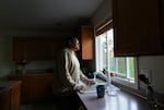 Luis Lamas gazes out the window of the home in Woodburn where he rents a room, May 14, 2025. Lamas is a Mexican citizen who came into the United States in 2021 and overstayed his temporary tourist visa, and is now returning to Mexico voluntarily.