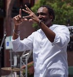 Rian Gayle interprets the music of a deaf hip-hop artist at the Make Music event in Salem in June 2019.