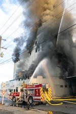 Smoke pours from the Pendleton Flour Mills on the morning of Wednesday, August 10, 2022 as firefighters work to control the blaze.