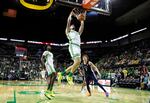 Oregon center Nate Bittle (32) dunks on Penn State in the first half of an NCAA college basketball game in Eugene, Ore., Saturday, Feb. 14, 2026.