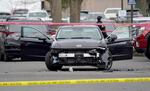 A vehicle is taped off near the 10000 block of Main Street, where two people were shot and wounded Thursday, Jan. 8, 2026, by a U.S. Customs and Border Protection agent in East Portland, according to the Portland Police Bureau and the FBI.