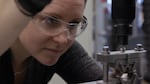 Boise State University Ph.D. Terra Miller-Cassman tests the mechanical properties of the isomalt-cellulose-sawdust composite in January. Mixing in cellulose and sawdust makes the isomalt less brittle. 