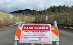 A sign marks the closure of Mount Pisgah Arboretum in Eugene, Ore., in January 2024.