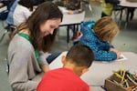 Hinds and a student work during class at Rock Creek Elementary.