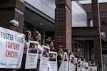 Mercy for Animals, an animal rights group, gathered outside of Fred Meyer in downtown Portland as part of a multi-city demonstration in protest of Foster Farm's alleged mistreatment of its chickens.