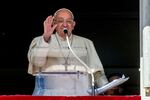 Pope Francis appears at his studio window for the traditional noon blessing of faithful and pilgrims gathered in St. Peter's Square at The Vatican, Sunday, Oct. 6, 2024.