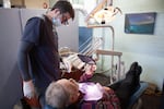 David Potts is treated by James Flanagin, the only dentist in Leslie, Ark., who operates out of a small clinic in the back of an antique store. About 25 million Americans live in dentist shortage areas, according to new research from Harvard University.