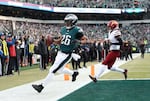 Saquon Barkley #26 of the Philadelphia Eagles scores a 4 yard touchdown against the Washington Commanders during the first quarter in the NFC Championship Game at Lincoln Financial Field on Jan. 25 in Philadelphia, Pennsylvania.