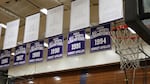 Championship banners hang above the Sunset High School gymnasium.