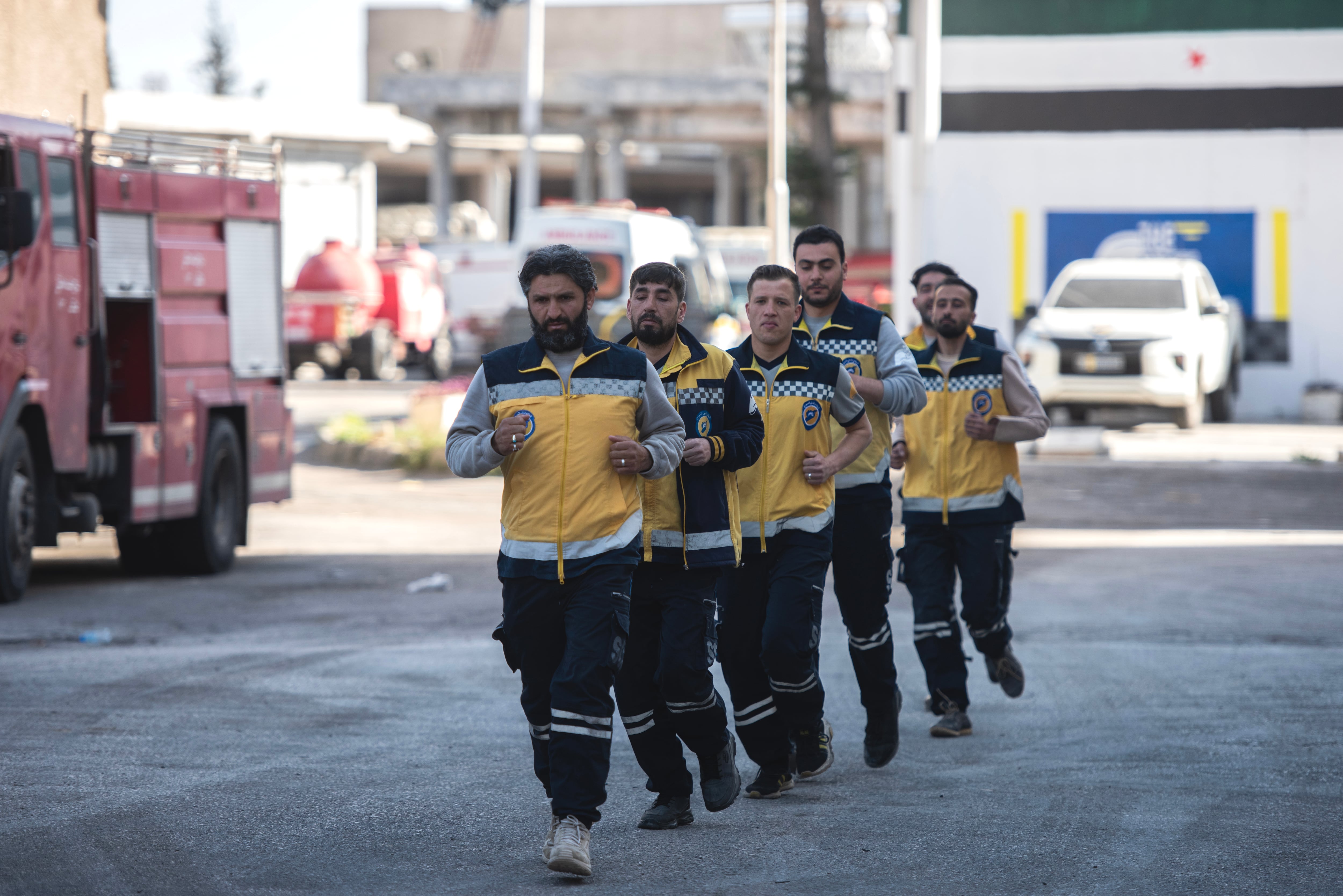 The White Helmets exercise outside the firehouse.