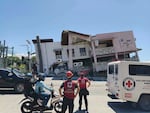 In this photo provided by the Philippine Red Cross, rescuers inspect the damage after an earthquake in General Santos, Philippines, Monday, June 8, 2026.