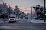 Drivers carefully drive through neighborhoods in Southeast Portland the morning after a snowstorm. 